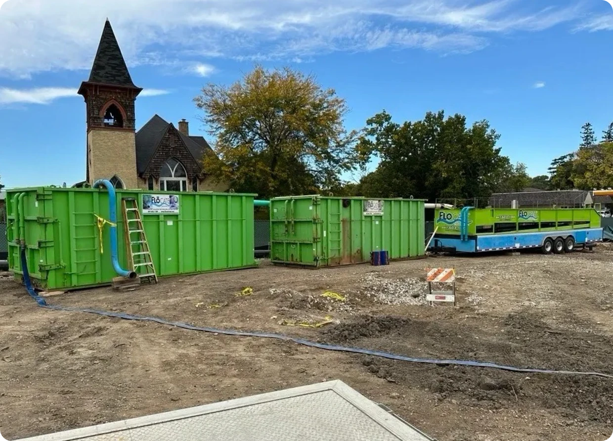 Church tower behind construction site