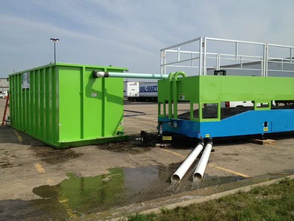 Green and blue industrial machinery outdoors