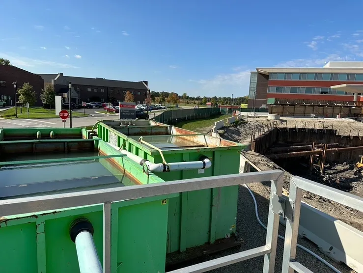 Construction site with green containers